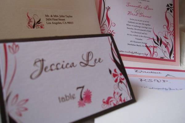 Floral and Swirl themed Wedding Invitations with matching place cards, address labels and monograms encased in an elegant pocketfold.