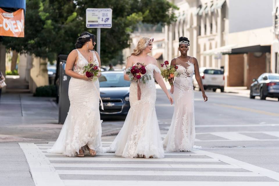 Three brides walking