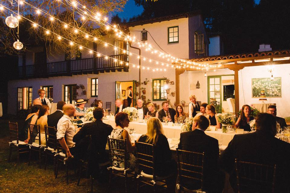 Elegant outdoor wedding reception with bistro lights in Montecito.