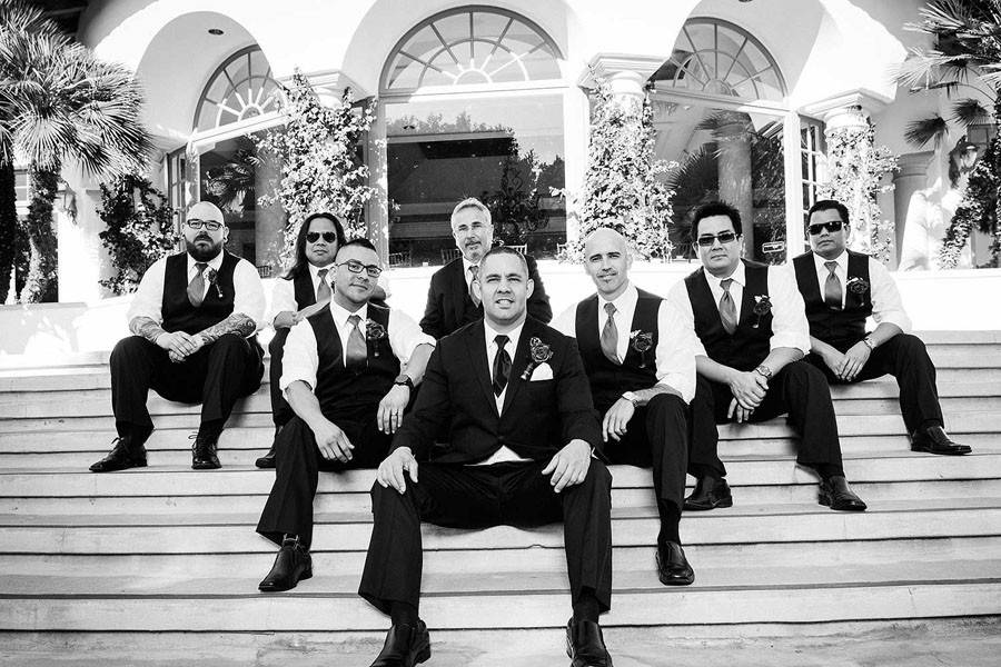 Black and white groomsmen group photo at Spanish Hills Country Club on the steps.