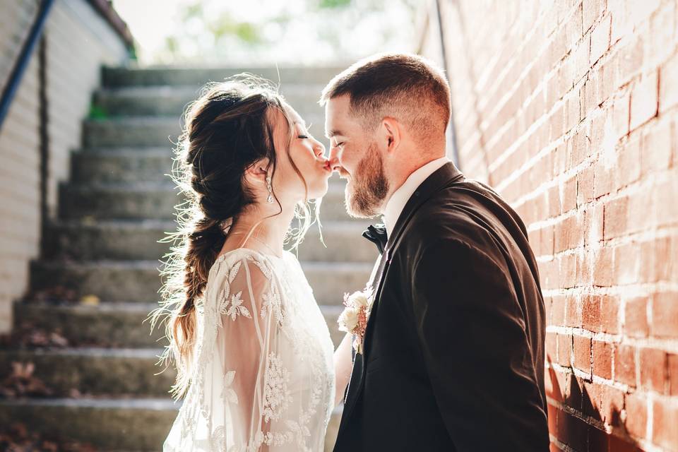 Bride kissing groom