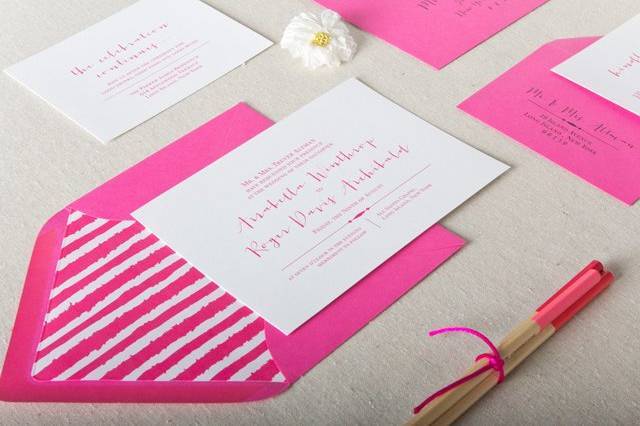 Hot pink wedding invites for the modern, trendy bride. Pink wedding stationery with modern calligraphy in Letterpress. Stylish wedding invitations for a vibrant couple celebrating with fun wedding decor. Edgy brides with hot pink wedding decor will love these vibrant wedding invites.