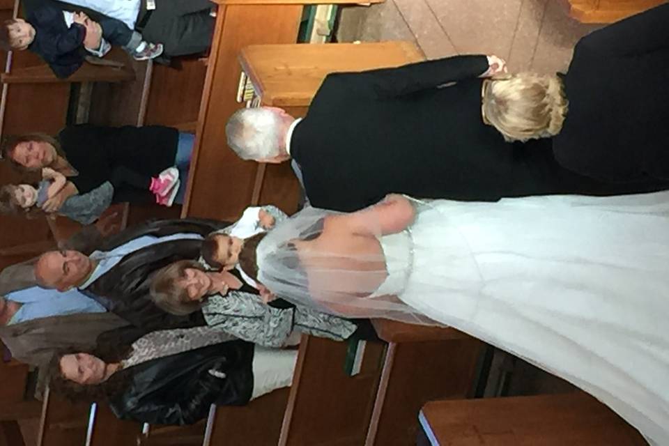 Photo of bride and her father walking down the aisle at St. Joseph's R.C. Church in Kings Park, NY.  We provided solo viola music for the wedding ceremony