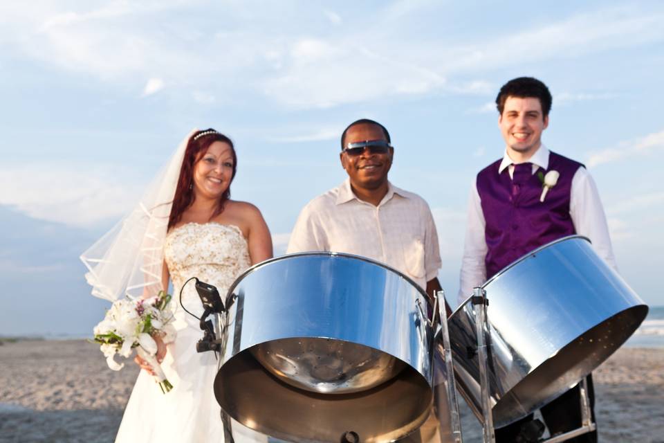 Steel Drum Player with bride and groom at beach wedding in Cocoa Beach Florida.