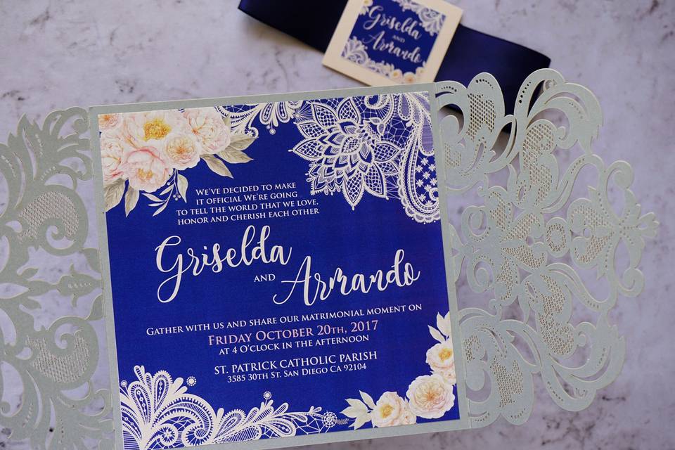 Lace and watercolor invitation in navy blue and silver with a laser cut enclosure