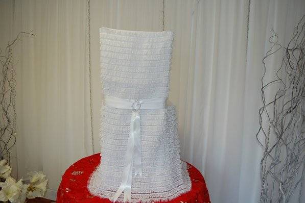 White satin tie-back chair cover with embellishment