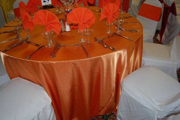 Gold linen sweetheart table, draping and stage linens