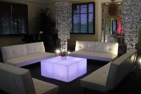 Modern lounge area. Leather sofa's, lighted tables and shimmery chandi's.