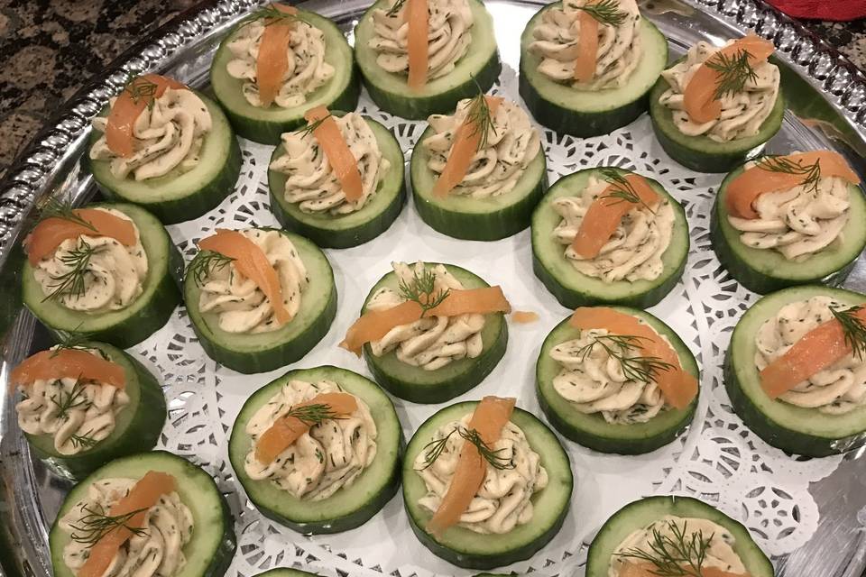 Smoked salmon mousse on cucumber with dill