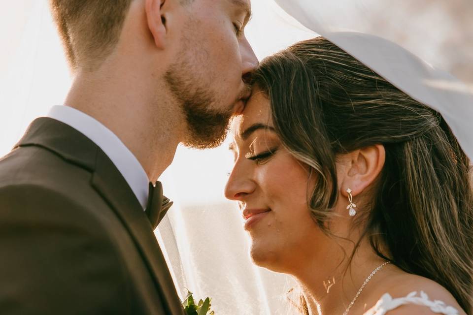 Kiss at her top of her head.