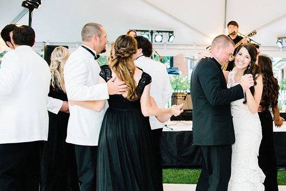 The couple and their guests dancing