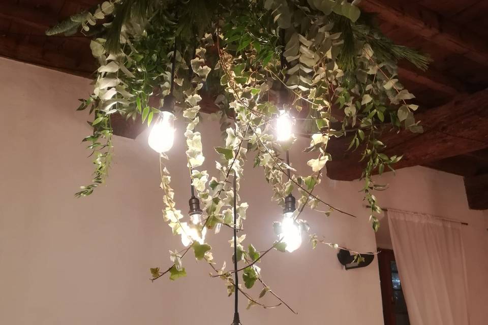 Chandeliers with greenery