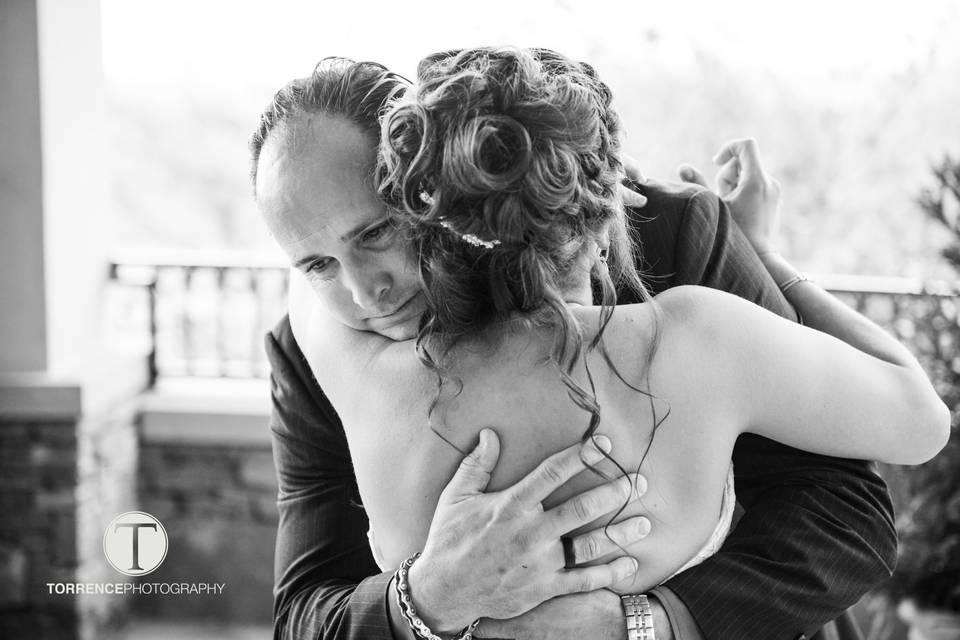 Bride and parent hug