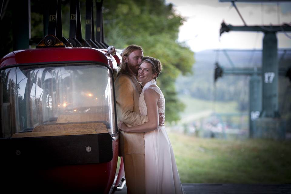 Jonathon and Elunia stealing a moment on The Gondola at  Mountian Chalet Wedding at Lutsen Mountains, Grand Marais Minnesota and North Shore weddings.