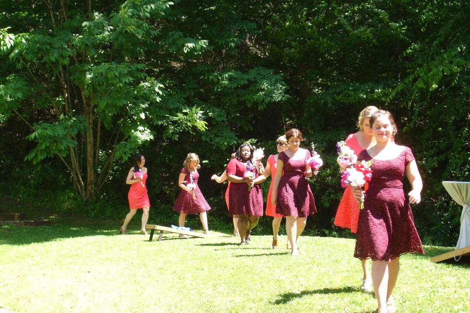 Bride and the bridesmaids walking