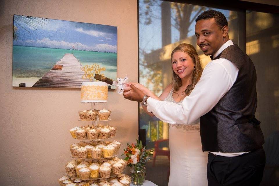 Couple slicing their cake