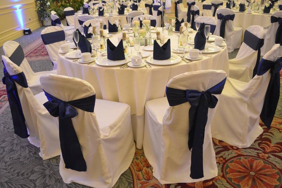 Ivory Banquet Chair Covers & Navy Blue Satin Sashes