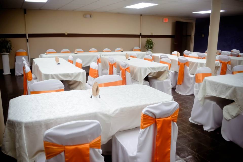 White Banquet Chair Covers & Orange Satin Sashes