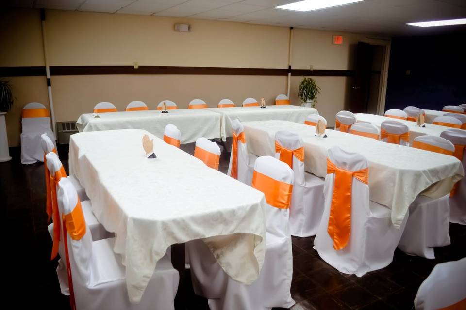 White Banquet Chair Covers & Orange Satin Sashes