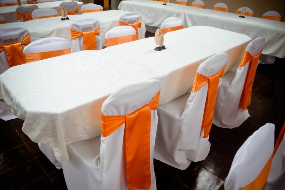 White Banquet Chair Covers & Orange Satin Sashes