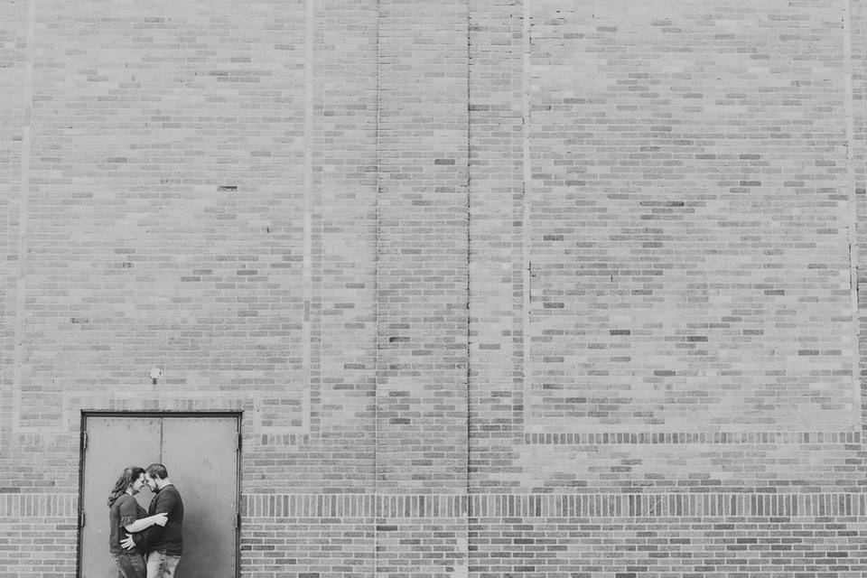 Couple in front of a large building - Bryson Buehrer Photography