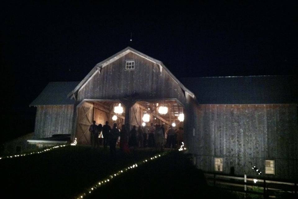 Lit up path to the barn