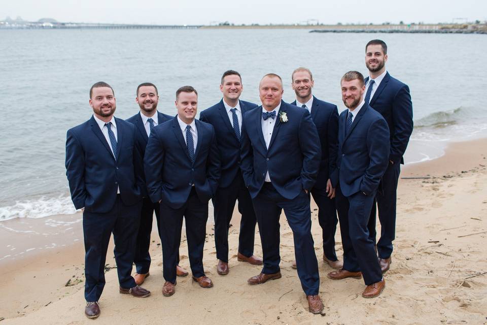 The groom and his groomsmen in navy blue