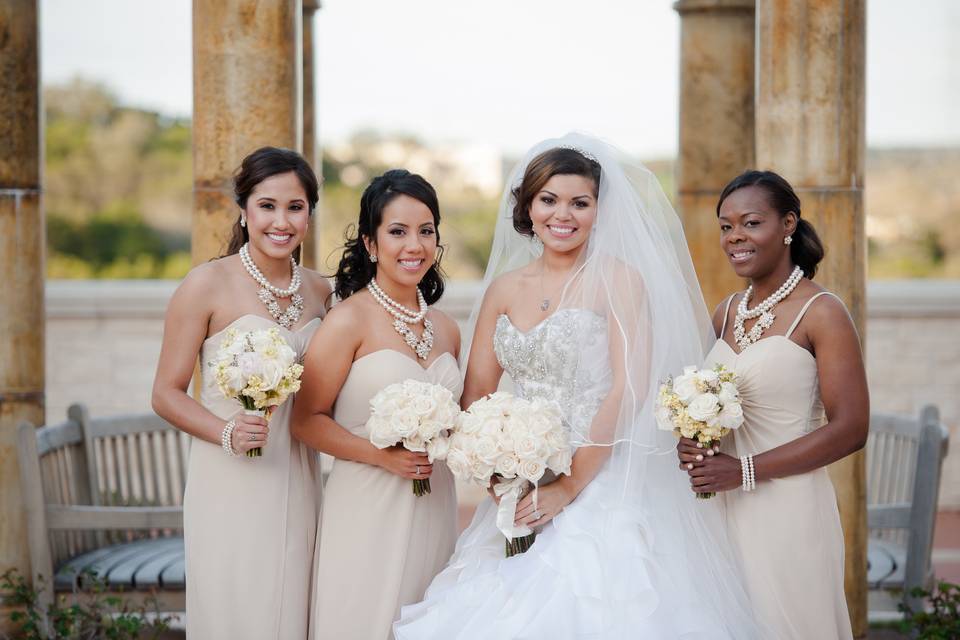 Bride & bridesmaids in front of one of the Eilan gazebos