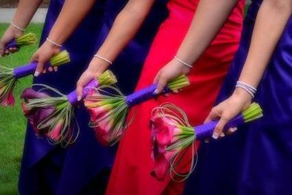 Hot Pink and Grape Callas accented with bear grass.