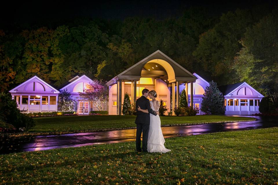 Couple kissing on the lawn