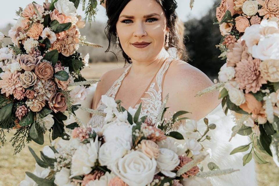 Bride with bridesmaid florals