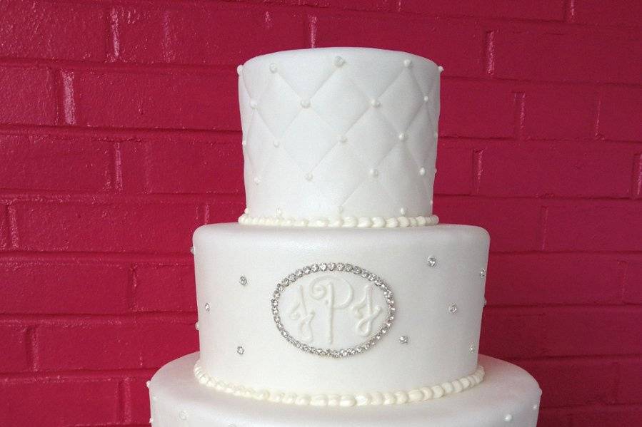 Four tier cake with purple flowers