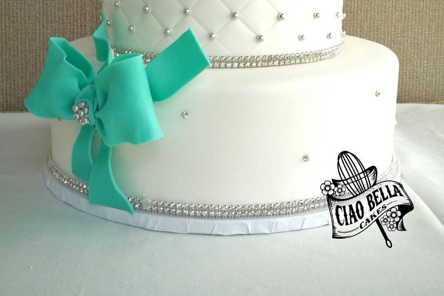 Three tier beaded cake with green bow