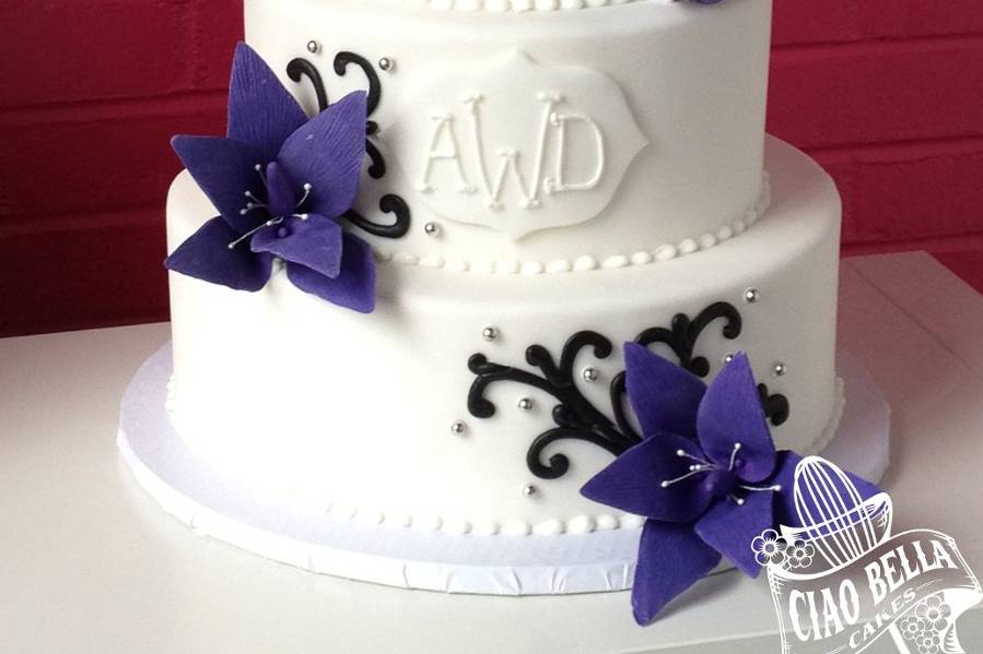 Four tier cake with purple flowers