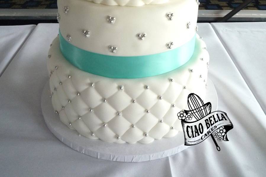Four tier beaded cake with turquoise lining