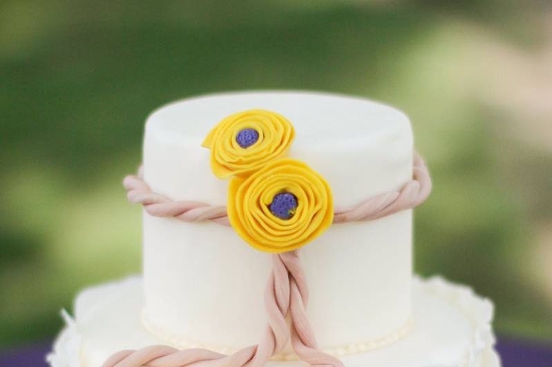 Two tier cake with yellow flowers