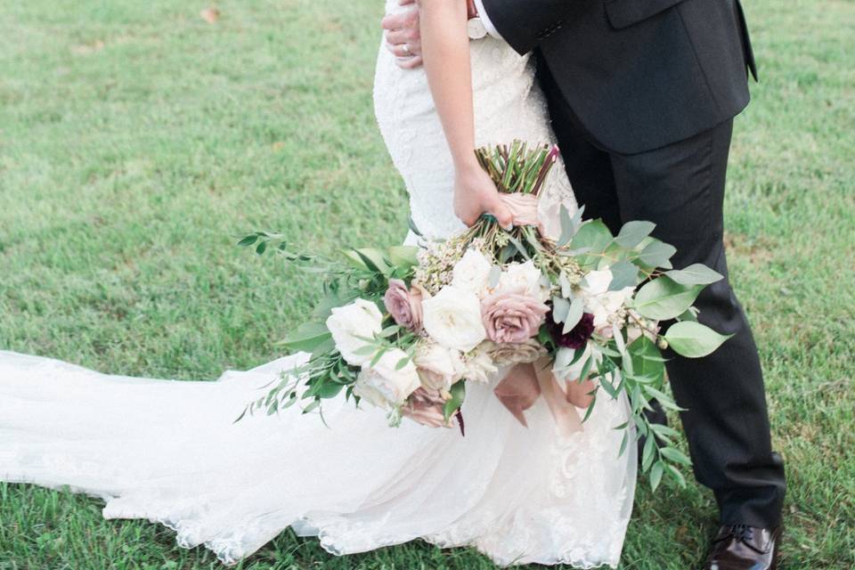 Groom holding his bride | Image: Ali McLaughlin