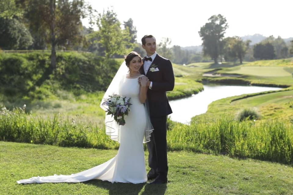 Portrait of the newlyweds by the course