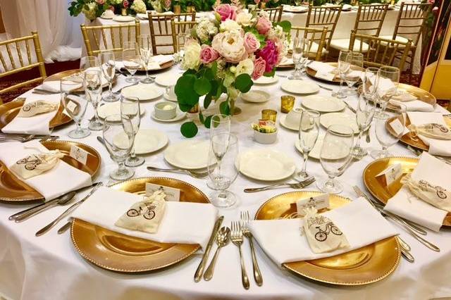 Gold table setting and floral centerpiece