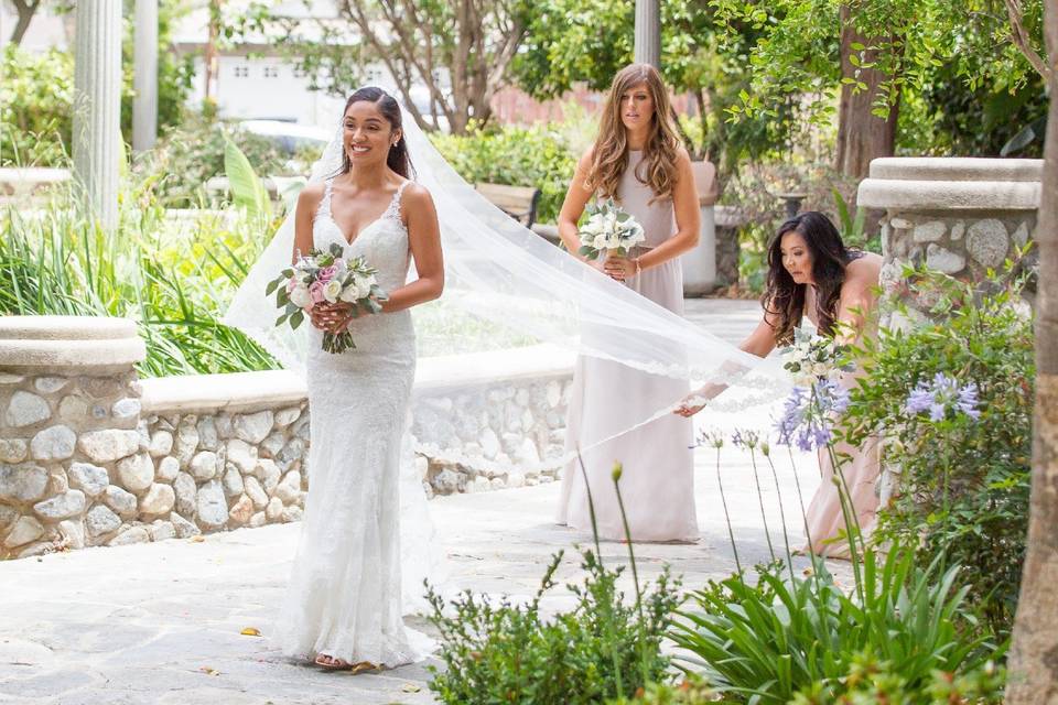 Bride being assisted