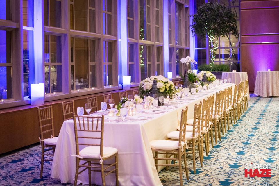 Custom-tuned winter blue wireless uplighting — at Fairmont Olympic Garden Room.