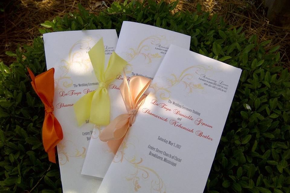 4x9 folded program with ribbon embellishment.