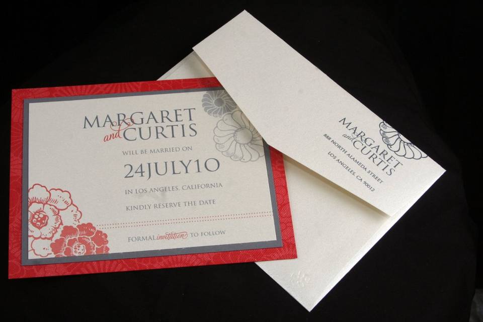 Three layered save-the-date card with matching envelope.