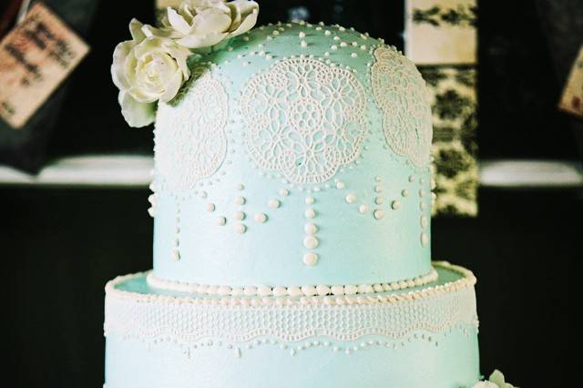 Blue domed cake in lace and pearls. The blue is all delicious buttercream!
