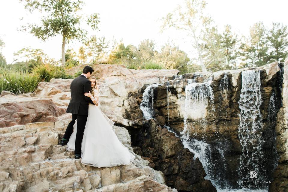 Happy couple  by the waterfall