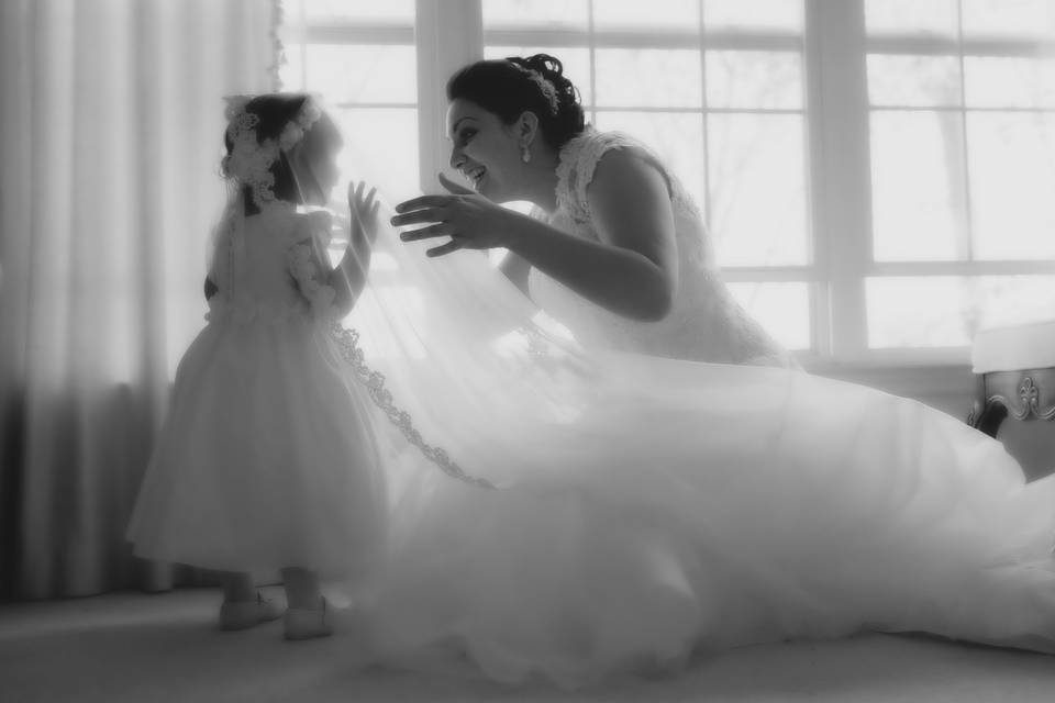 The Bride and Flower Girl, share a moment . . .