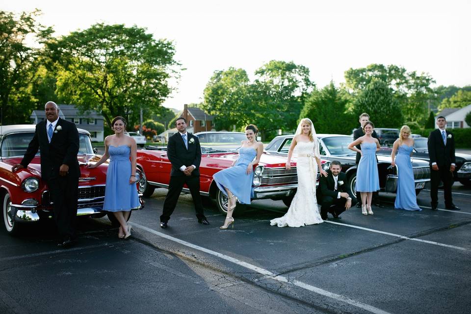 The Bride & Groom rode off in style with a classic car parade!