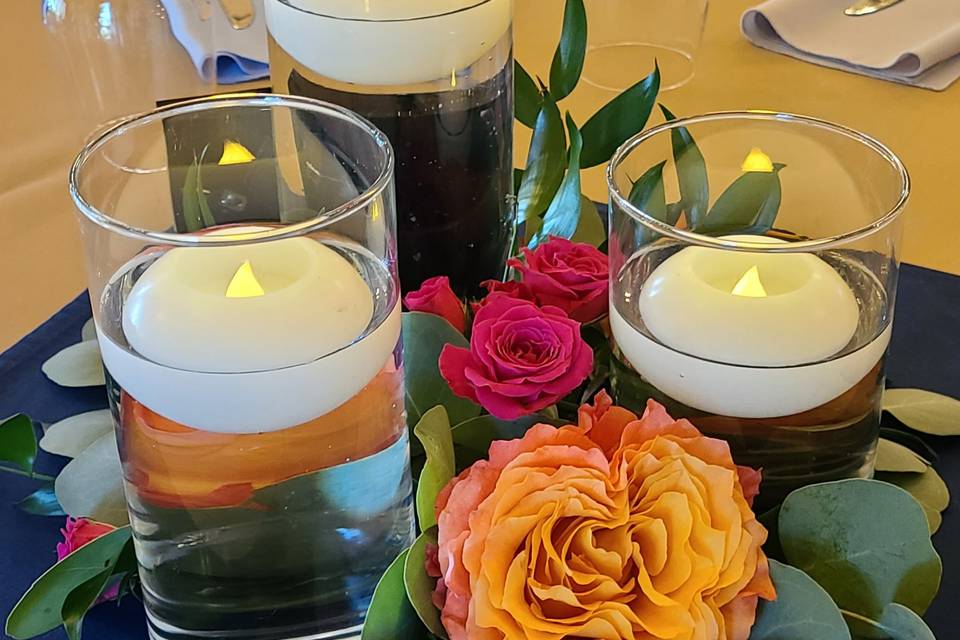 Candle centerpiece with greens