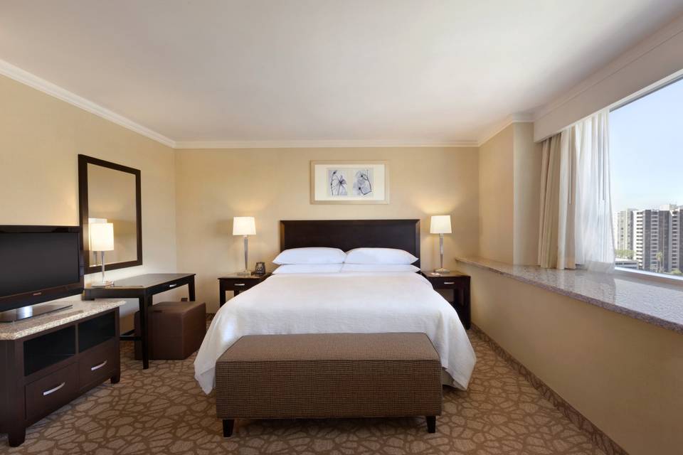 Bedroom of our mountain view corner suite with a king size bed.