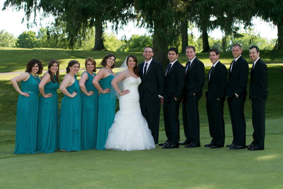 Newlyweds, bridesmaids, and groomsmen